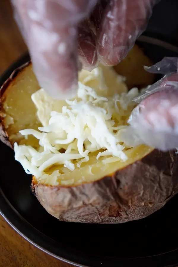 Munch Station build-your-own base: A crispy-skinned baked jacket potato, opened and mashed with butter and melted cheese.